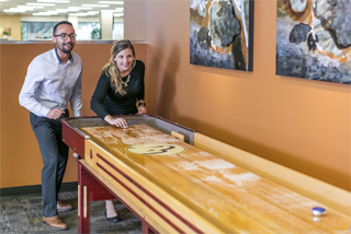 Two State National employees playing shuffleboard