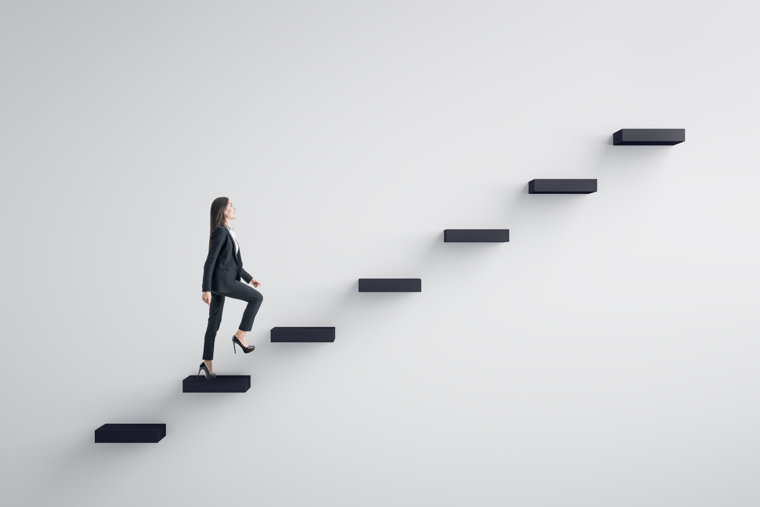 businesswoman climbing stairs to success